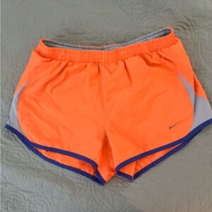 Nike dri-fit running shorts, size small, bright orange.